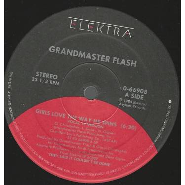 GRANDMASTER FLASH  - GIRLS LOVE THE WAY HE SPINS ( VOCAL LP VERSION ) / LARRY'S DANCE THEME ( TRIBUTE TO THE ELECTRIC BOOGIERS )